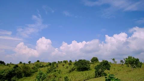A mountain range with a cloudy sky in the background Stock Photos