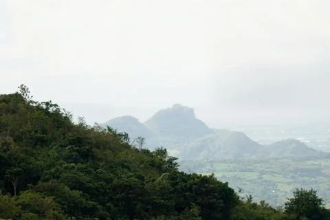 A mountain range with a cloudy sky in the background Stock Photos