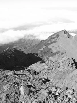 A mountain range with a cloudy sky in the background Stock Photos