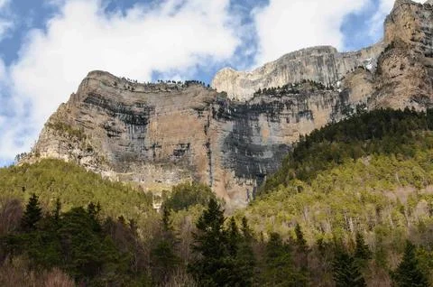 A mountain range with a cloudy sky in the background Stock Photos