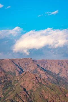 Mountain range covered with bright blue sky at afternoon from different angle Stock Photos