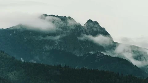 Mountain range covered with clouds. Giewont peak in Tatra mountains, Poland Stock Footage 203919736