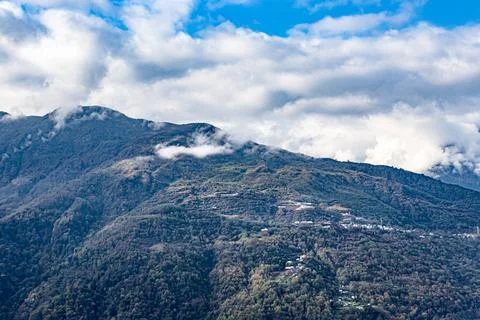 Mountain range covered with dramatic sky at morning from flat angle Stock Photos