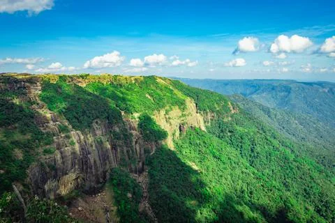 Mountain range covered with green forests and bright blue sky at afternoon fr 写真素材