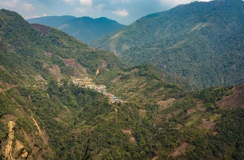 Mountain range with dense green forests at morning from flat angle Fotos de archivo