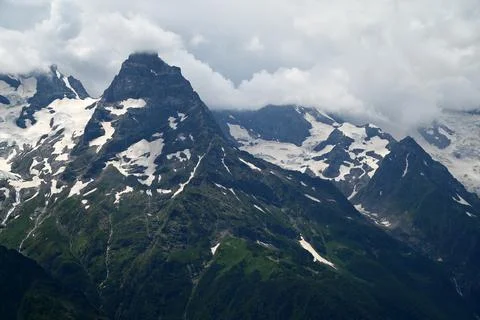 Mountain range with dramatic clouds Stock Photos