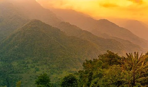 Mountain range with dramatic orange sky at morning from flat angle 写真素材