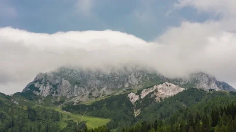 Mountain Range Gets Hidden Behind Low Clouds Stock Footage 146334102