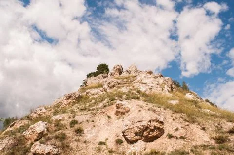Mountain range, hill, trees and clouds Stock Photos