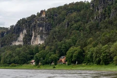 A mountain range with a house in the middle of it Stock Photos