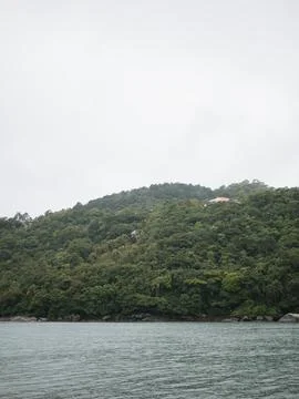A mountain range with a house on top of it Stock Photos