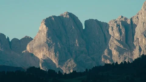 Mountain Range Illuminated by the Warm Light of an Early Morning Sunrise 库存影片 331163892