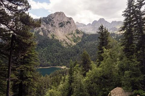 Mountain range with a lake in the foreground Stock Photos