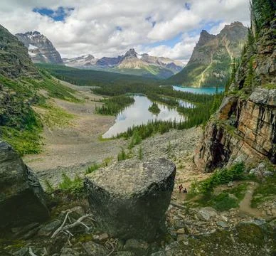 A mountain range with a lake in the middle Stock Photos