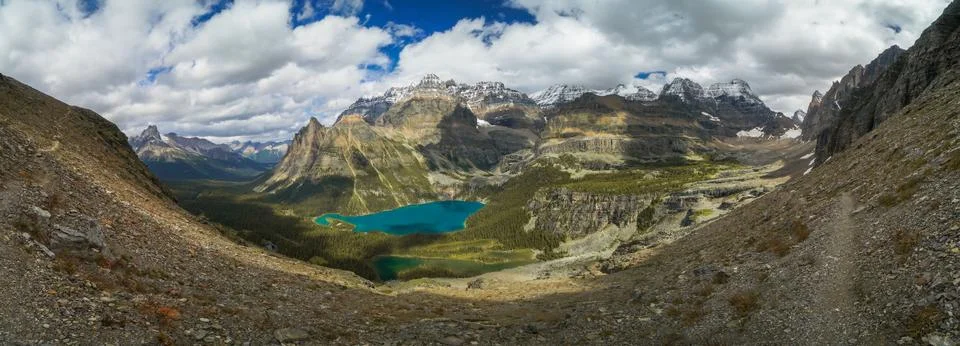 A mountain range with a lake in the middle Stock Photos