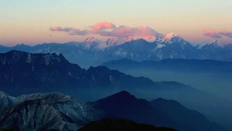 Mountain range landscape at sunset with clouds and blue hues Stock Footage 311819090