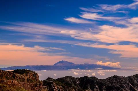 A mountain range with a large mountain in the background Stock Photos