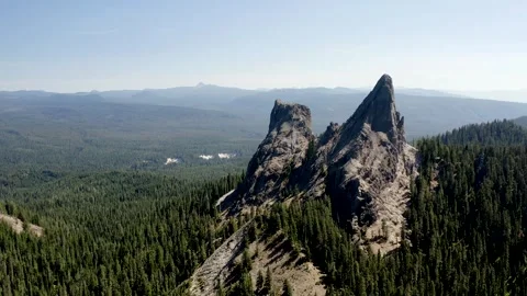 A mountain range with a large peak in the middle Stock Footage 272655326