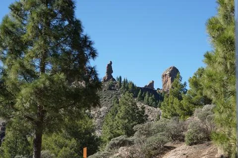 A mountain range with a large rock in the middle Stock Photos