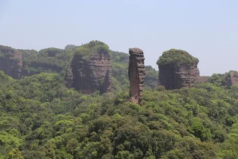 A mountain range with a large rock in the middle Stock Photos