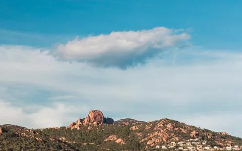 Mountain range with a lone cloud in the blue sky Stock Photos