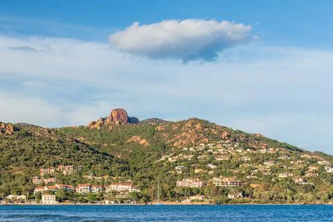Mountain range with lone cloud in the blue sky on the on the French Riviera c Stock Photos