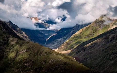 Mountain range with low clouds with dramatic sky, india Stock Photos