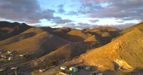 Mountain Range in Magdalena Bay Mexico at Sunrise with small fishing village Stock Footage 334638618