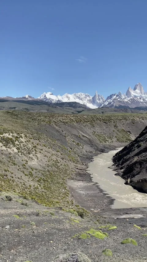 A mountain range with Mount Fitz Roy and clear blue sky in the background Stock Footage 277550898
