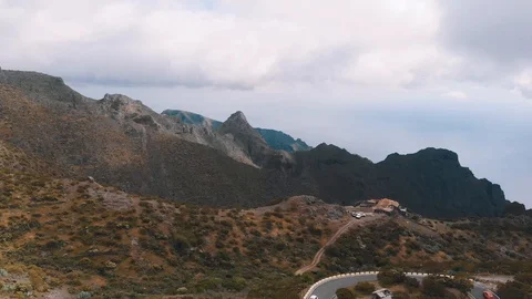 Mountain range in the national park in cloudy weather, the road on the top and Stock Footage 111308160