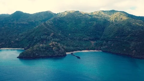 Mountain Range next to the Ocean in the Comoros - Aerial drone shot Stock-Footage 124572002