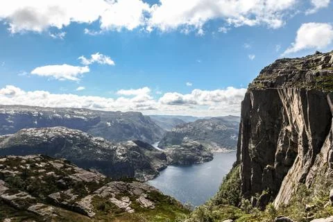 A mountain range in Norway overlooking the Luse Fjord and the Preikestolen .. Stock Photos