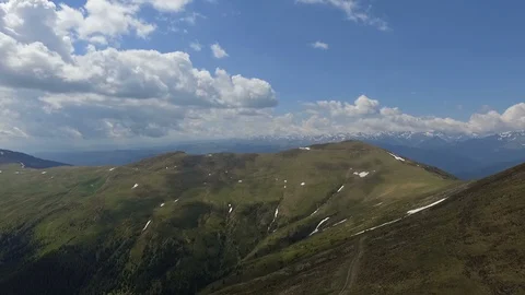 Mountain range with offroad tracks drone view panning Stock Footage 119632700