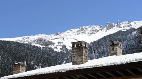 Mountain Range Over Rooftops and Chimneys Stock Footage 60673810