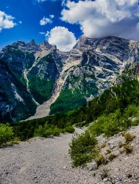 A mountain range with a path leading up to it Stock Photos