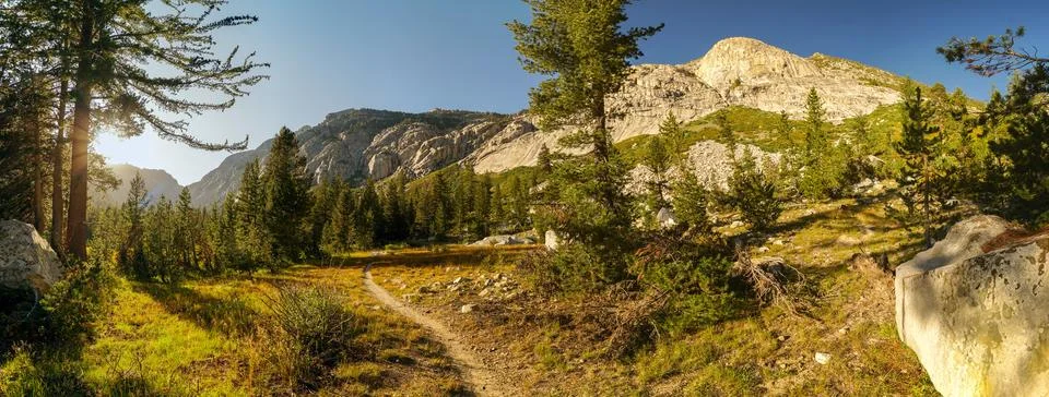 A mountain range with a path leading to it Foto stock