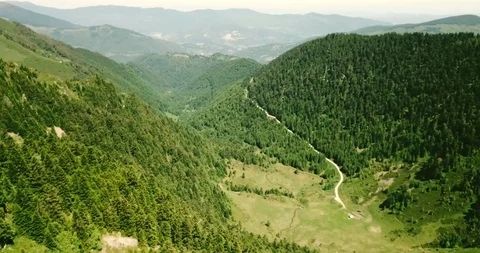 Mountain range in the Pyrenees with forest and road Stock Footage 94206940