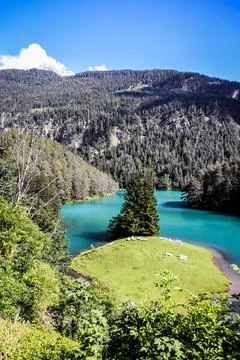 A mountain range with a river running through it Stock Photos