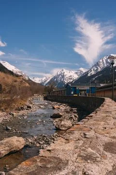 A mountain range with a river running through it Stock Photos