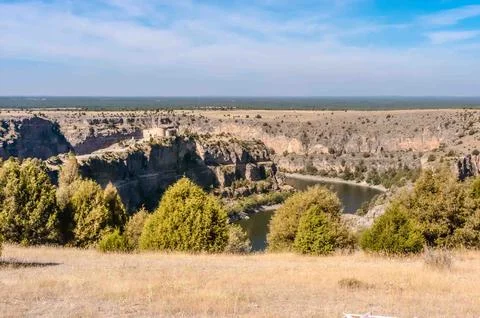 A mountain range with a river running through it Stock Photos