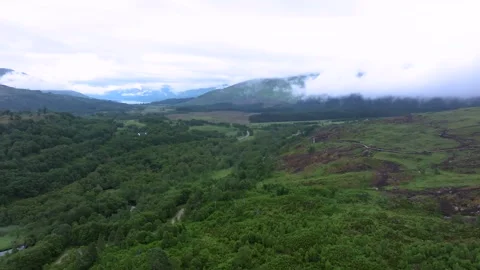 A mountain range with a road in the middle Stock Footage 306492217