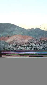 A mountain range with a road running through it Stock Photos