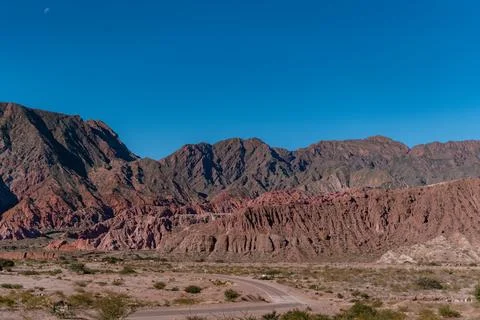 A mountain range with a road running through it Stock Photos