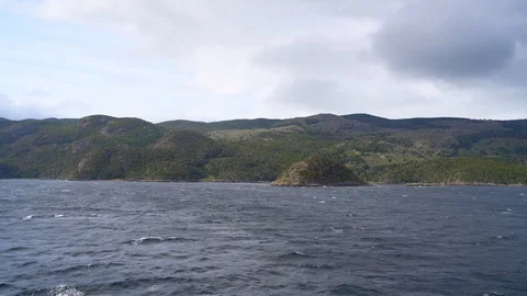 A mountain range seen from a ship in the Cape Horn area Stock Footage 109509014