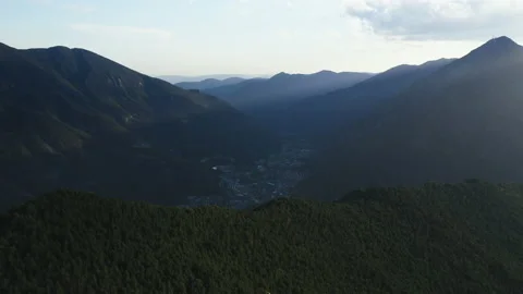 Mountain range shadow over the city in the valley. Andorra La vella 库存影片 131390638