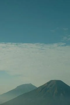 A mountain range is shown in the distance with a blue sky in the background Stock Photos