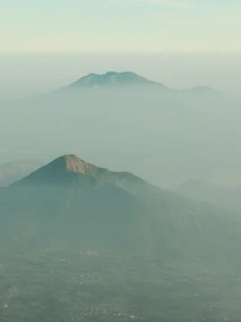 A mountain range is shown in the distance with a hazy, foggy atmosphere Stock Photos
