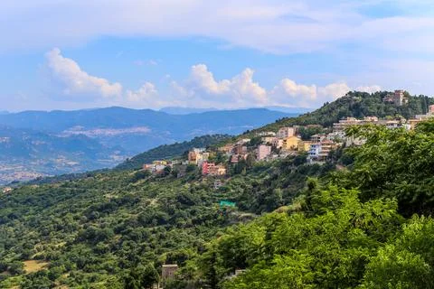 A mountain range with a small town in the valley on the island Sardinia in .. Stock Photos