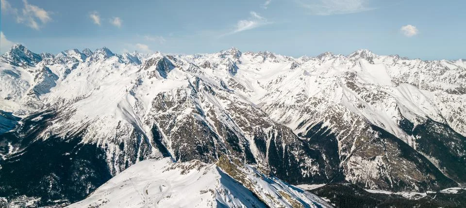 Mountain range in snow and sky Stock Photos