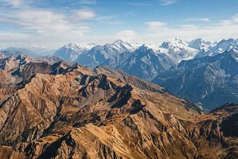 Mountain range with snow capped peaks. Stock Illustration